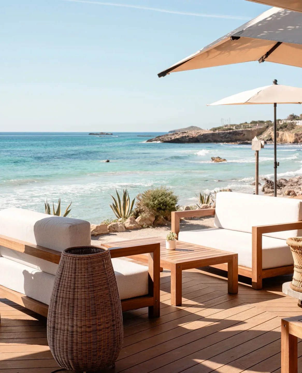 Aiyanna beach club in Ibiza with comfortable seating and ocean views under umbrellas.