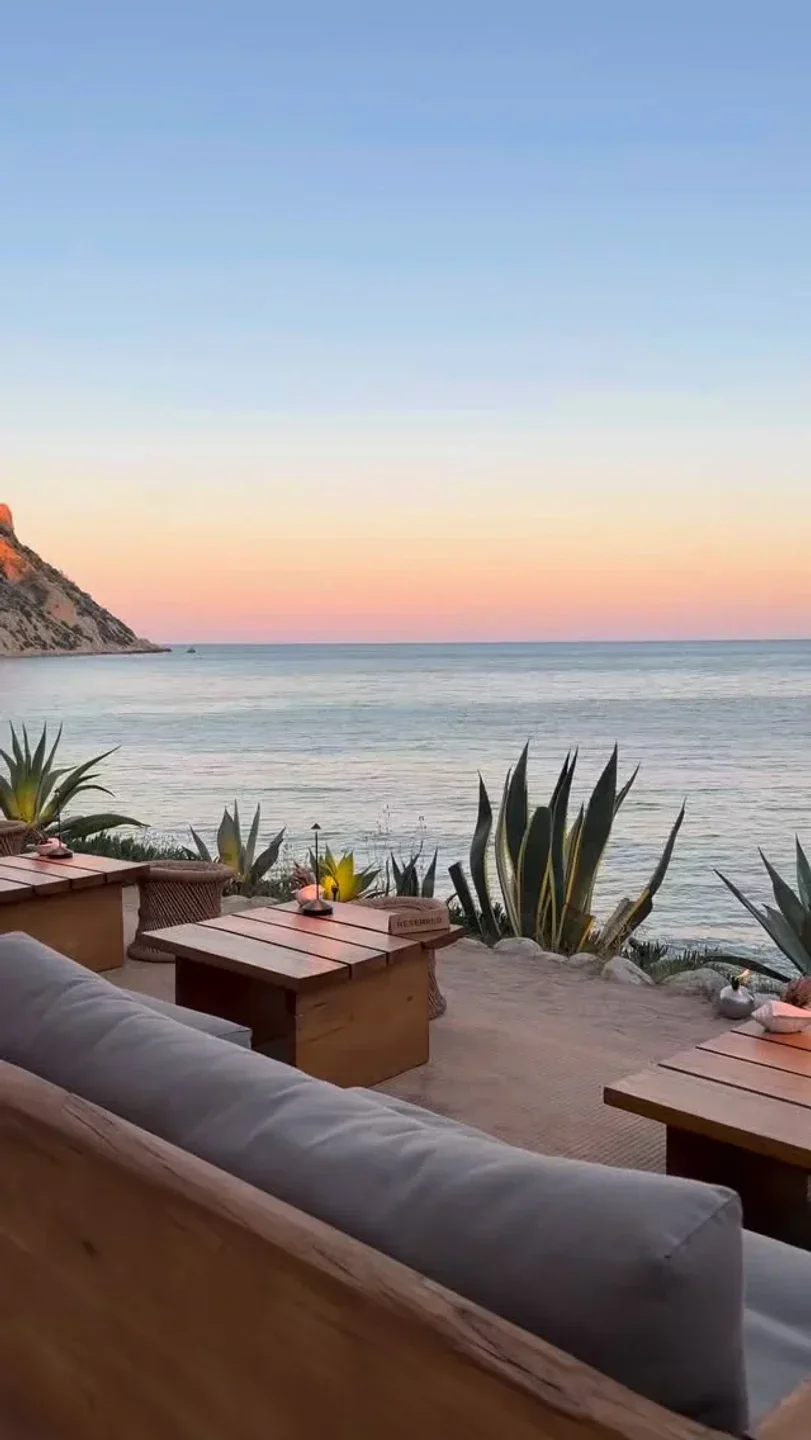 Amante Ibiza beach club offers stunning sunset views over the Mediterranean Sea with outdoor seating.