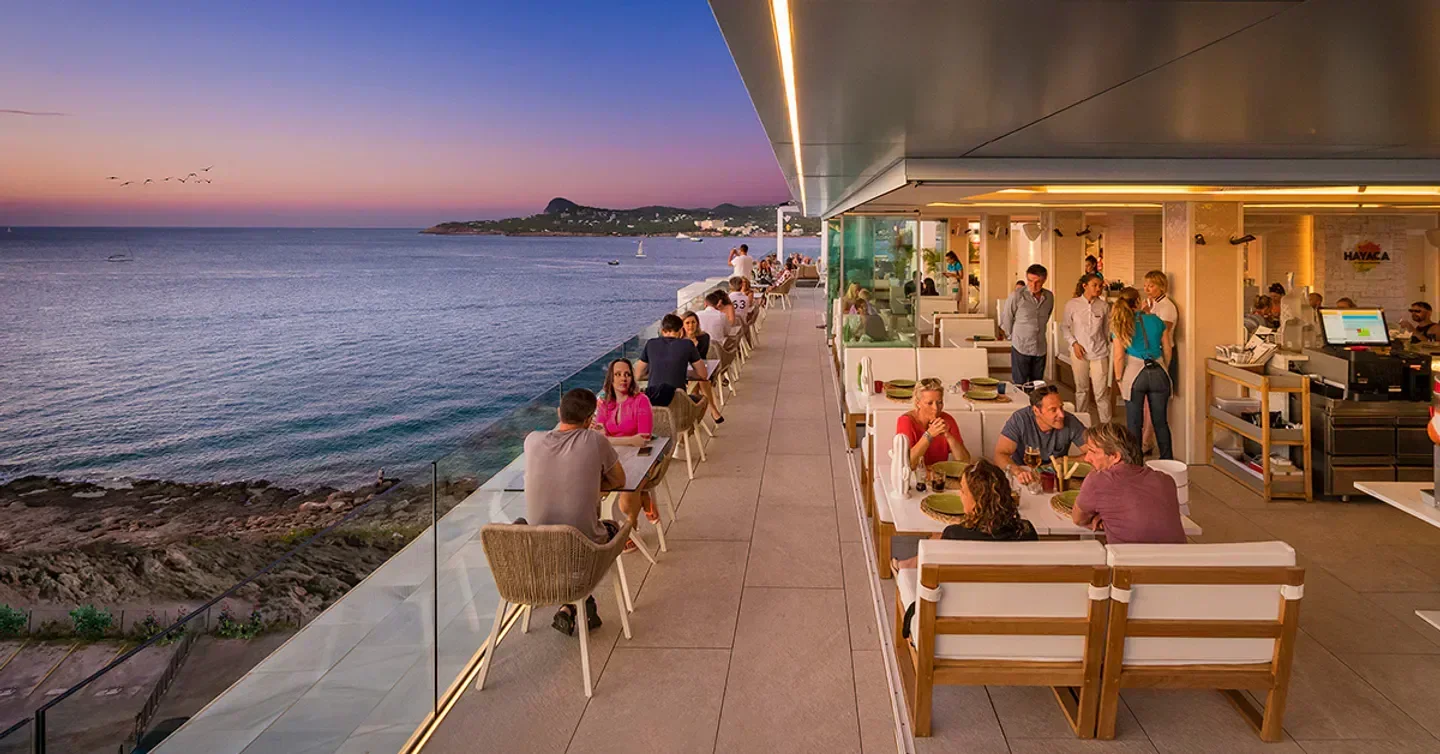 Hayaca Rooftop in Ibiza offers stunning sunset views over the sea for a memorable dining experience.