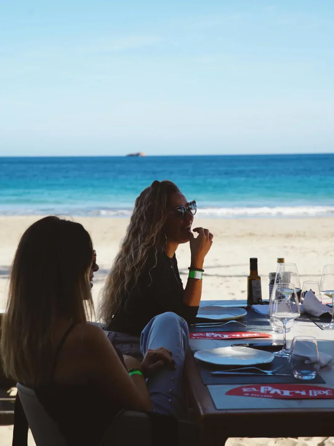 Dining at Nassau Beach Club in Ibiza, enjoying the beautiful beach views.
