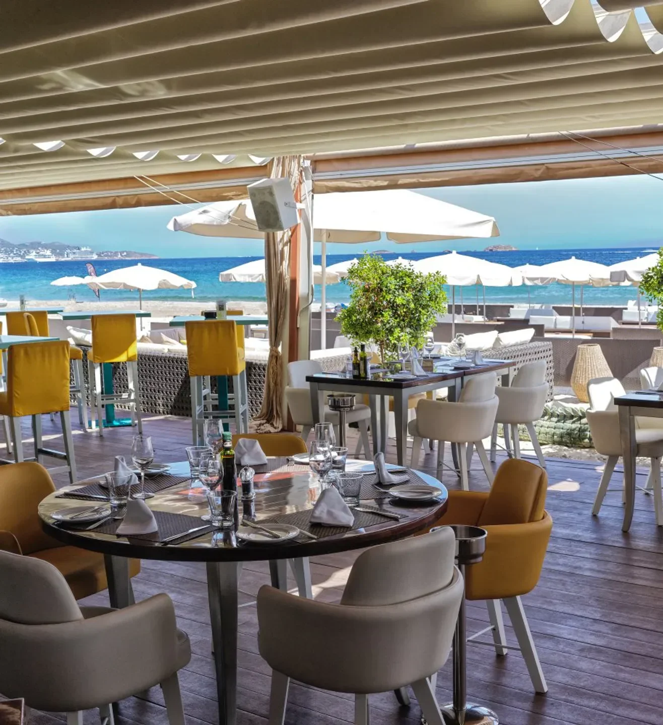 Tanit Beach Club restaurant in Ibiza, with a sea view from the dining tables.